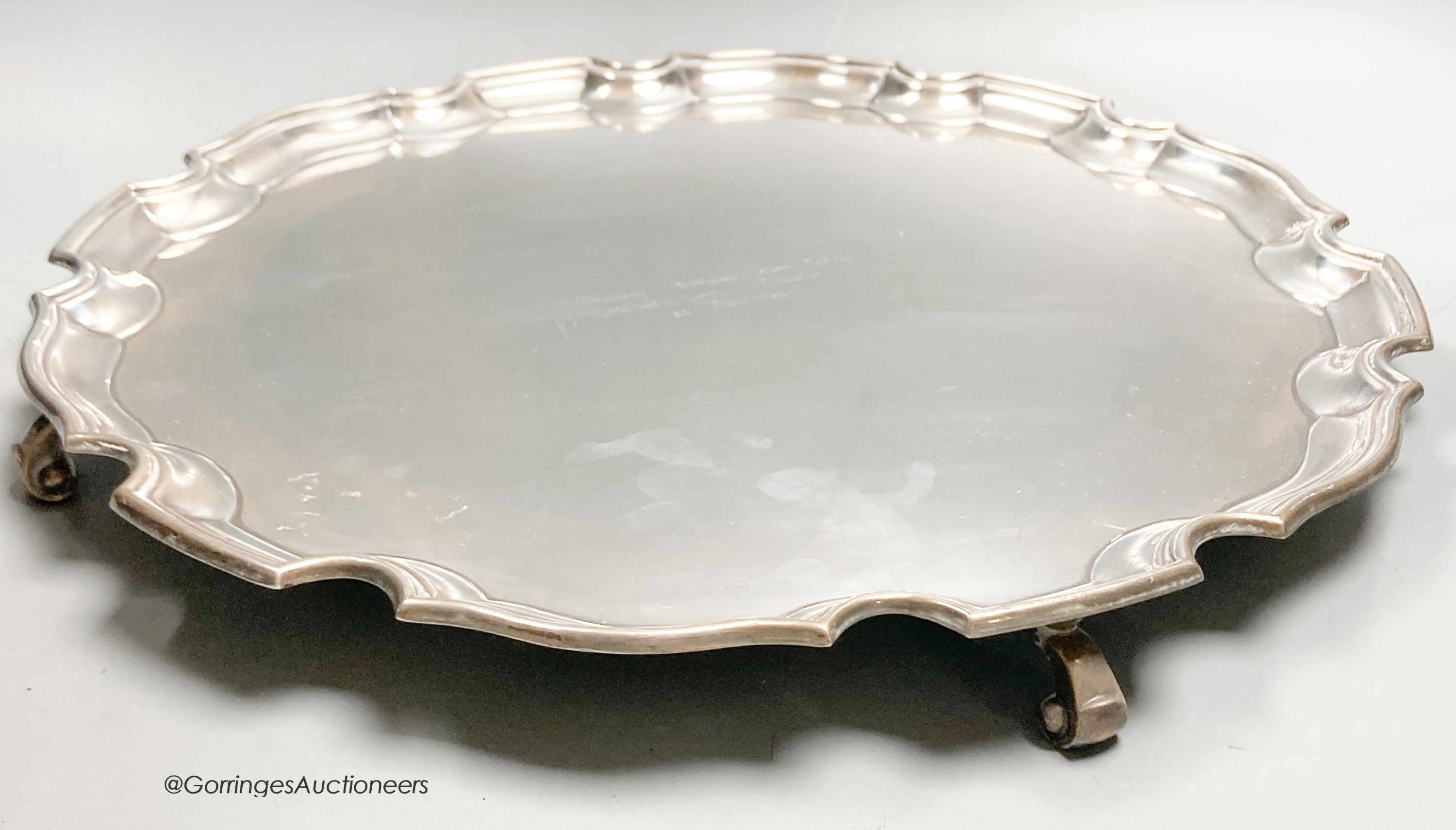 A circular silver salver with Chippendale border, diameter 41cm, Birmingham 1950, 63.5oz.